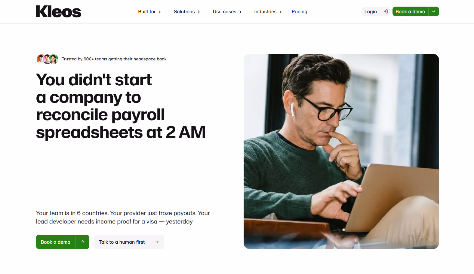 Kleos website homepage — hero of a global payroll platform with a headline and a Book a demo button